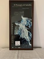 Full view of wood framed print showing the artwork and text for Il Presepio di Salzillo exhibition Feb-Mar 1999, with carved wooden frame and slight chip on lower left corner.