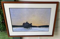 Full view of the framed art print showing the horse-drawn wagon in a snowy landscape at sunset.