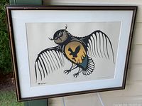 Full front view of framed print showing owl with sunset silhouette inside its body and stylized wings