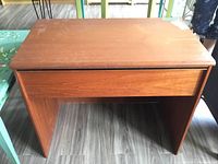 Front view of vanity table with lid closed