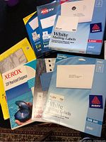 Photo showing various Avery adhesive address label packages and Xerox pearlized copy paper box