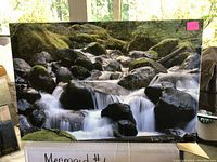 Full view of waterfall image with moss covered rocks and flowing water