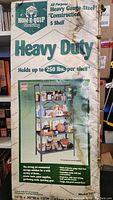 Box front showing brand Home-Equip, product features, holding capacity per shelf, and shelving unit image.
