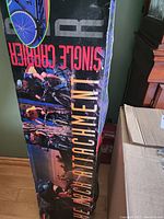 Photographs of the single carrier bike rack box showing branding and bike attachment images and features