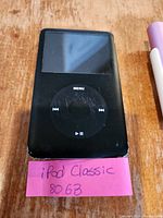 Black Apple iPod Classic 80GB showing front view with screen and click wheel.
