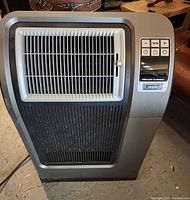 Front view of one Lasko ceramic heater showing the air flow grill and control panel with buttons Ion, timer, power, plus, and minus.