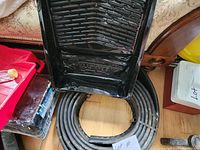 Black plastic paint tray with textured roll area