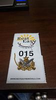 Front view of badge pinned to Rest Easy removals card