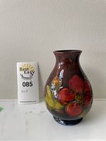 Front view of vase showing floral design and Rest Easy lot card