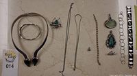 Overview of all jewelry pieces laid out on flat surface
