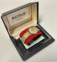 Men’s Waltham Swiss 30 Jewel Super-Automatic watch displayed inside its original box, showing exterior of watch and band with box interior branding.