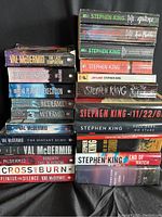 Stack of 19 fiction books by Stephen King and Val McDermid, shown to identify titles and condition.