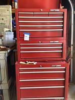 Front view of stacked top, middle, and bottom units showing overall configuration and drawer count