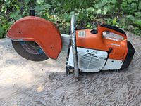 Side profile showing blade guard, handle and body color