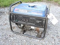 Front view of Yamaha EF2600F generator showing control panel with power switch, AC outlets, and Yamaha branding.