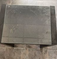 Top view showing glass surface with dust and some marks