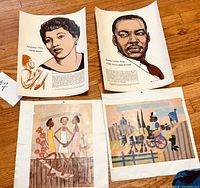 Four posters and prints laid out on floor, showing Leontyne Price, Martin Luther King, and two artwork prints depicting Black figures and scenes.