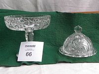 Footed crystal bowl with geometric pattern and matching covered butter dish on green background