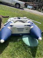 Front view of inflated dinghy showing bow area and existing patch