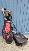 Full shot of the TaylorMade golf carry bag loaded with multiple golf clubs.