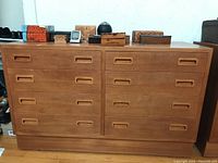 Straight-on view of full dresser showing overall form, drawer configuration, and wood tone.