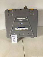 Closed gray plastic carrying case with 'Serpentine Saw' and 'Mastercraft Maximum' logos on the front.