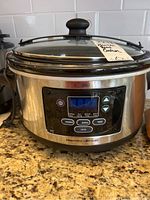 Front view of Hamilton Beach slow cooker with glass lid and control panel