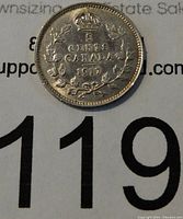 Reverse side of 1917 Canadian silver 5 cents coin showing denomination, country, year, wreath and crown design.