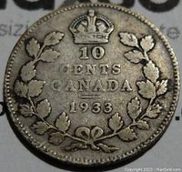 Reverse side with denomination, date, crown, and wreath design.