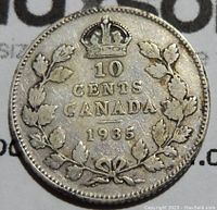 Reverse side showing denomination '10 Cents', 'Canada', year '1935', crown and wreath design.