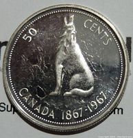 Reverse side of 1967 Canadian 50 cents coin showing howling wolf, '50 CENTS' and 'CANADA 1867-1967' inscriptions