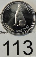 Reverse of 1967 Canada 50 Cents silver coin showing sitting howling wolf, text '50 CENTS CANADA 1867-1967'.