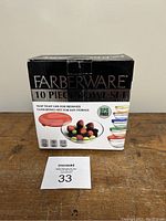 Box front showing Farberware 10-piece bowl set with BPA-free lids, glass bowls nest for storage, and image of bowls with lids.