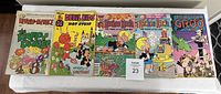 Photo showing front covers of five comic magazines: Dennis the Menace The Daffy Dozen 1976, Devil Kids Hot Stuff 1975, two Richie Rich comics from 1989 and 1990, and Sergio Aragones Groo from 1989.