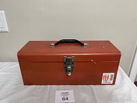 Closed red Mastercraft toolbox displaying handle, latch, and brand sticker.