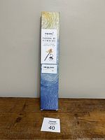 Front view of the tall box labeled Razai Painting by Numbers with the kit contents listed.