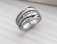 Front view showing the diagonal rows of cubic zirconia and organic silver design