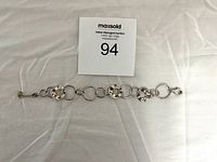 Full view of the vintage Silpada silver bracelet showing hammered and smooth circular links laid flat