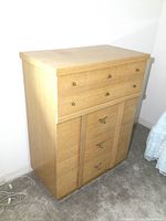 Front view of vintage Knechtel tall boy dresser showing drawer arrangement and drawer pulls.