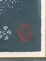 Close-up of print corner showing edition number 23/60, date 1978, and red oval detail on dark background.
