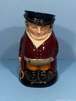 Front view of the Royal Doulton Toby Mug depicting The Huntsman figure, showing detailed facial features and attire.