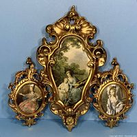 Three ornate Italian Florentine gold frames with Victorian female portraits painted on silk, showing overall view.