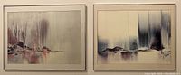 Two framed abstract lakeside pictures side by side on a wall, one with blue tones and one with red tones, each measuring 24 by 30 inches, glass mounted with wire hangers visible.