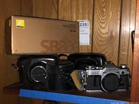 Nikon SB-800 Speedlight flash with original box and Canon AE-1 with leather case