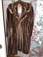 Full front view of vintage brown mink fur coat, showing the entire length, button closure, collar, and satin lining inside.