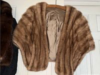 Front view of brown mink fur stole showing fur texture and satin lining.