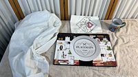 View of entire lot on a table showing linen, placemats, napkin, and mug
