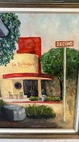 Close-up view of the painting showing the bakery building, the street sign, and the artist's signature.