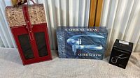 Photo showing the full wine carrying case, boxed corkscrew, and boxed wine tumbler.