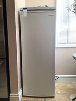 Full exterior view of white Insignia upright freezer
